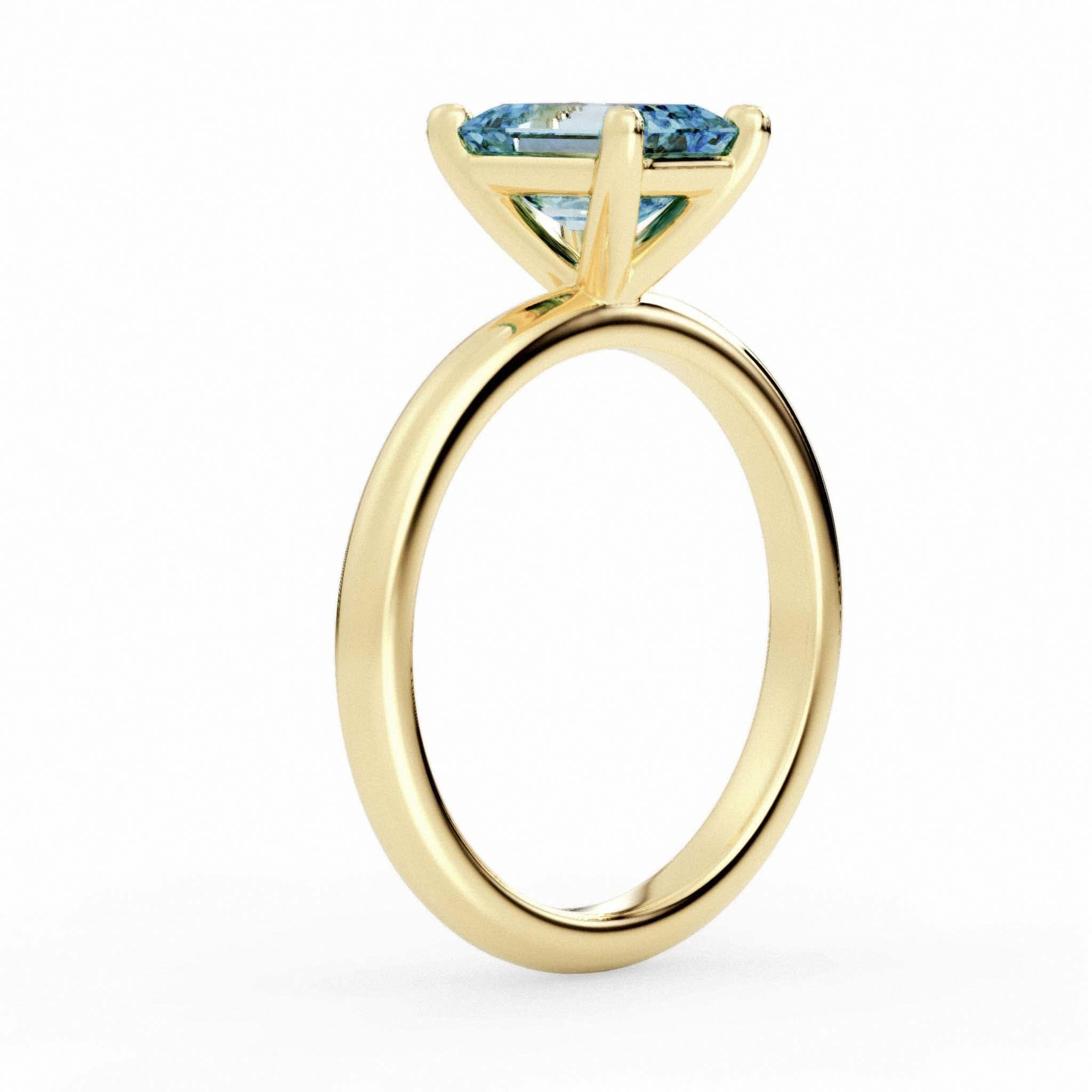 The Monique Ring – Gold & Topaz Solitaire